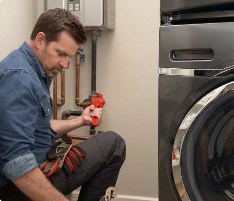 Contractor fixing a washing machine